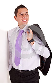 Business man leaning against wall