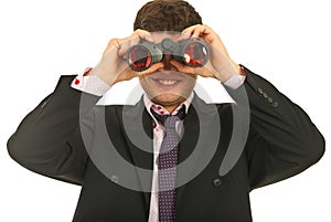 Business man looking through binocular