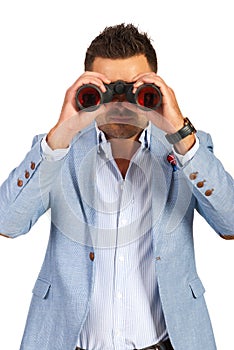 Business man looking through binocular