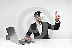 Business man looking at data while sitting and wearing VR glasses. Deviation.