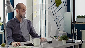 Business man looking at financial statistics on computer