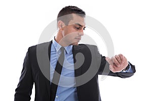 Business man looking at his watch. In a rush. Isolated on white