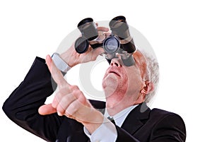 Business man looking upwards through binoculars