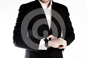 The business man looks his watch for checking the time isolated on white background