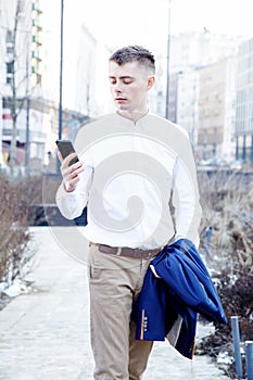 Business man. A man with a book and a laptop. The guy speaks through the phone on the street. The guy in the glasses makes notes i