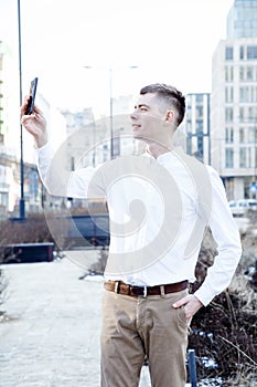 Business man. A man with a book and a laptop. The guy speaks through the phone on the street. The guy in the glasses makes notes i