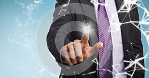 Business man mid section with flare and interface against blue background