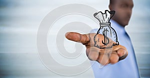 Business man with money bag graphic in outstretched hand against blurry blue wood panel