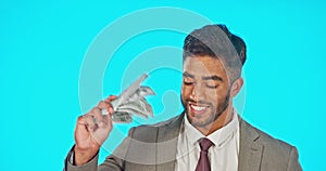 Business man with money fan isolated on studio background for wealth, cash winning or financial freedom with smile. Rich