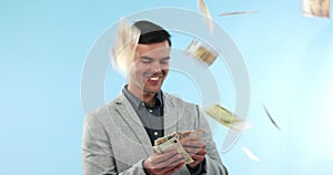 Business man, money rain or cash in studio with financial freedom, winner prize or reward. Professional person celebrate