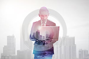 Business man with multiple exposure holding tablet computer