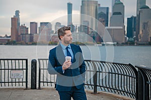 Business man in New York. Businessman in suit outdoor. Portrait of an handsome businessman at urban style. Mature