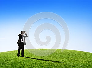 Business Man Observing Nature With a Telescope