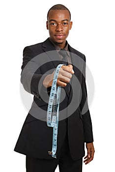Business man offering a measuring tape