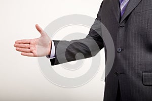 Business Man Offers Handshake