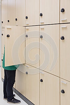 Business man opening Modern wood Interior of locker