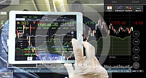 Business Man operate tablet for financial analysis stock investment.