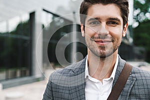 Business man outdoors near business center