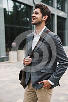 Business man outdoors near business center