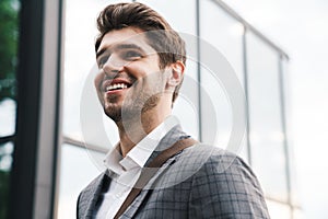 Business man outdoors near business center