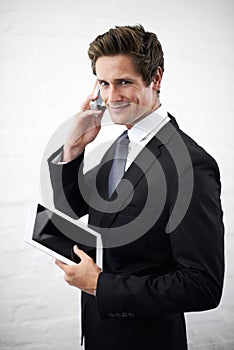 Business man, phone call and happy with tablet, portrait or contact for networking by wall background. Entrepreneur