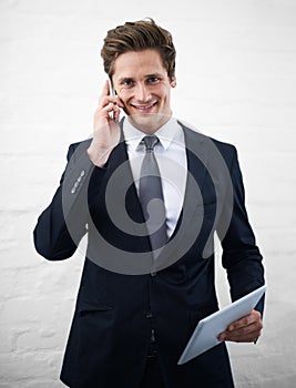 Business man, phone call and tablet with smile, portrait or contact for networking by wall background. Entrepreneur