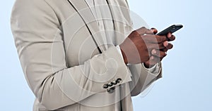 Business man, phone text and hands typing from social media and web networking in a studio. Male entrepreneur
