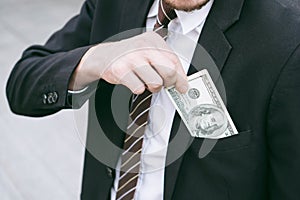 Business man Picking up money US dollar bills