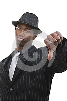Business Man In Pin Striped Suit & Hat Giving Thumbs Down photo