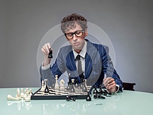 Business man playing chess