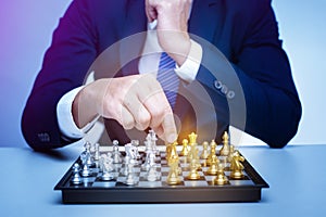 Business man is playing chess, business management strategy concept