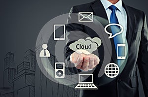 Business man pointing at cloud computing