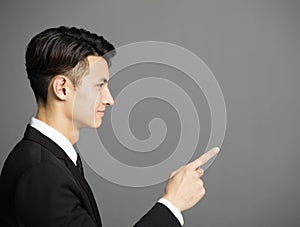 business man pointing at copy space