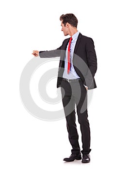 Business man pointing at his back