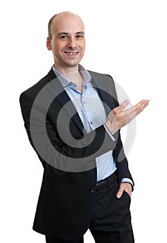 Business man pointing to copy space