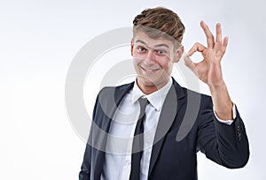 Business man, portrait and OK hand gesture for success, support and agreement with emoji on white background. Praise