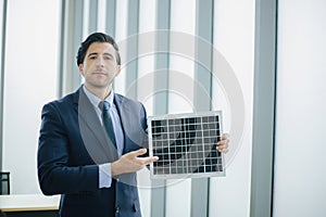 Business man present Solar Power Environment Concept