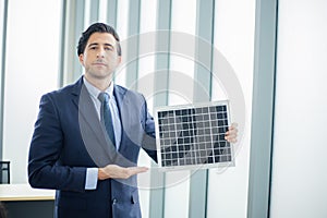 Business man present Solar Power Environment Concept