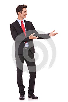 Business man presenting something or inviting