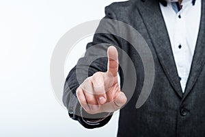 Business man press index finger invisible button