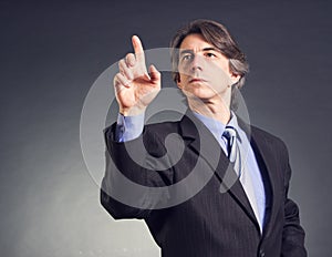 Business man pressing a button