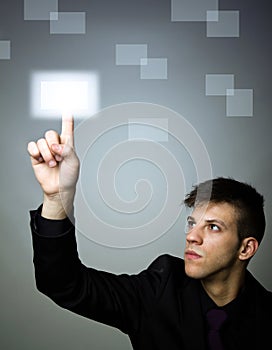 Business man pressing a digital button