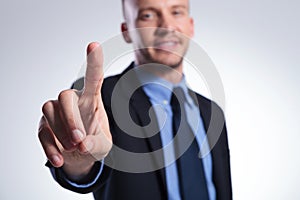 Business man pushes button
