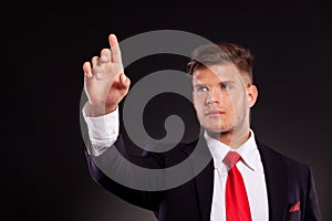 Business man pushing button