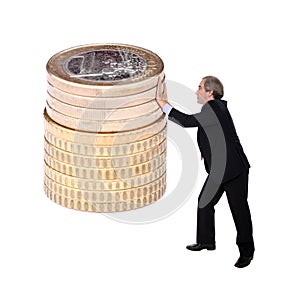 Business man pushing a pile of euro coins
