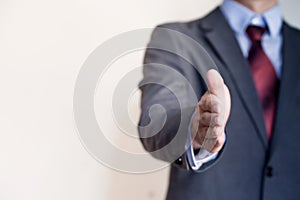 Business man reaching out hand to shake - Business Concept and G photo