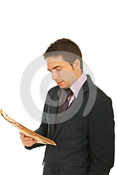 Business man reading newspaper