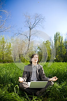 A business man relax on the grass field