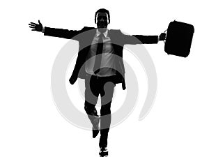 Business man running happy arms outstretched silhouette