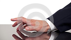 Business man's hand tapping fingers on a desk